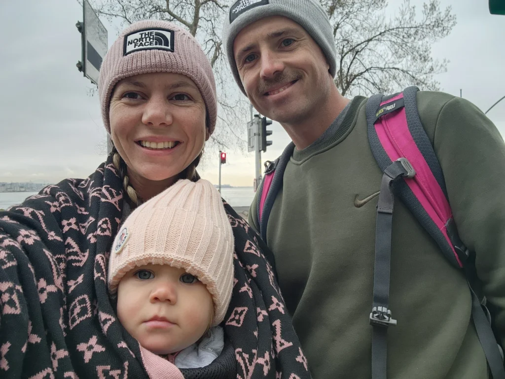 a family holding their baby on the streets of istanbul