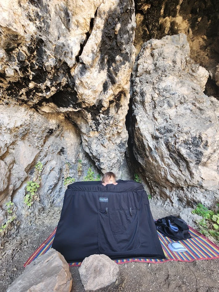 baby sleeping in the jungle in thailand while mum and dad go rock climbing