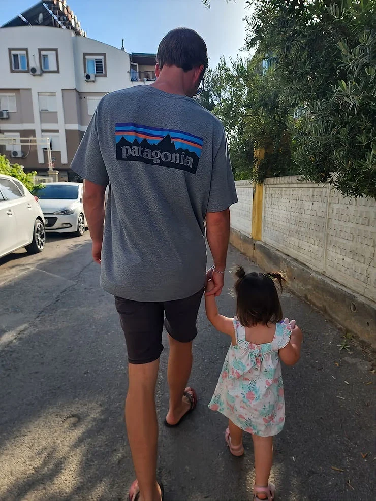 daddy daughter walking to the market holding hands