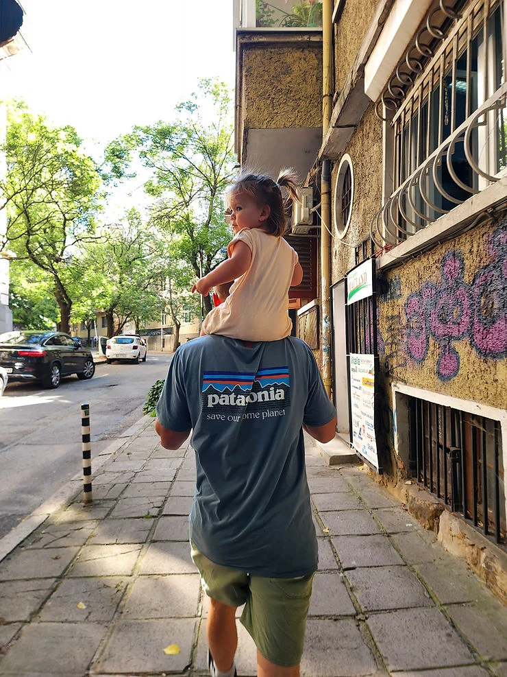 dad and daughter walking through the streets of sofia in bulgaria