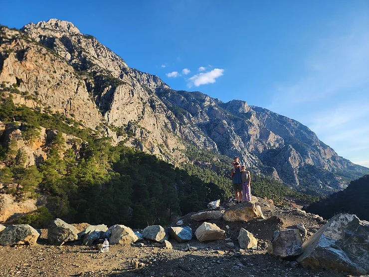 day trip to citdibi  mum and dad and baby standing in front of the mountains