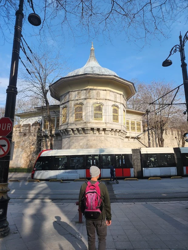 man walking towards a mosque in istanbul