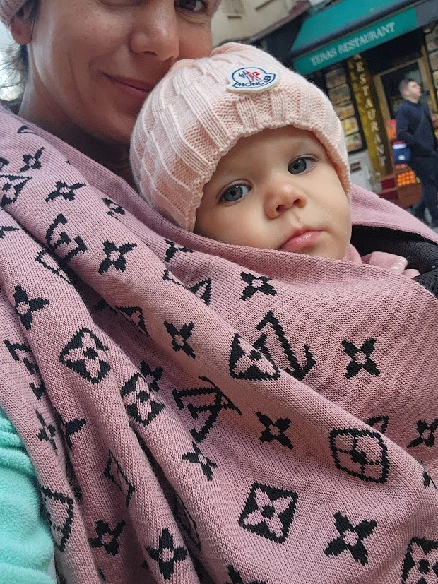 baby wrapped in mums LV scarf in istanbul