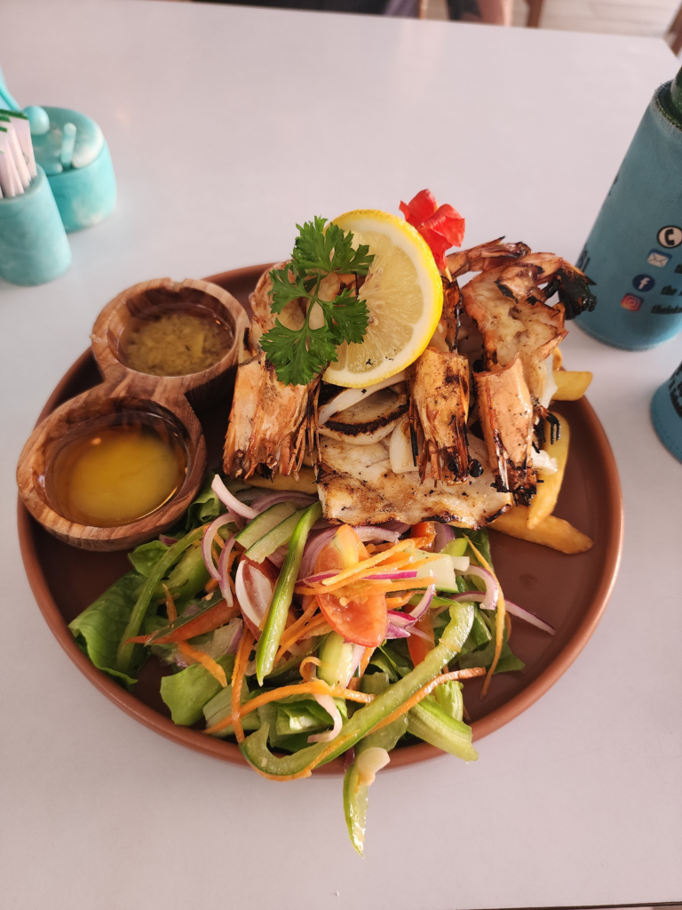 grilled fresh seafood and salad in bali with lemon and garlic butter