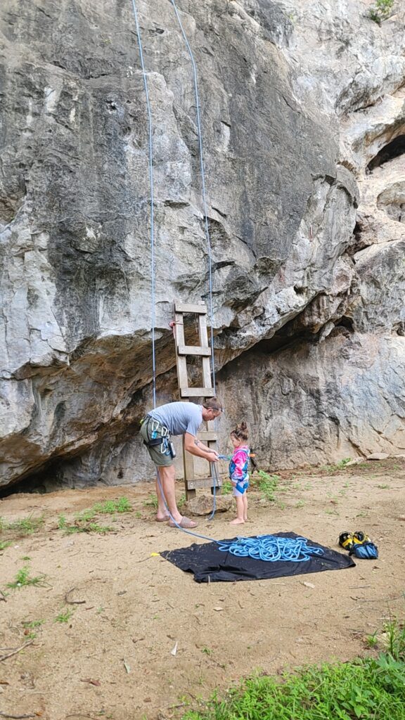 dad taking his daughter rock climbing in thailand
